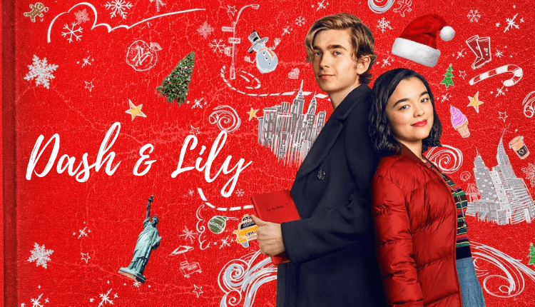 Dash & Lily standing back to back behind a red background with Christmas decorations.