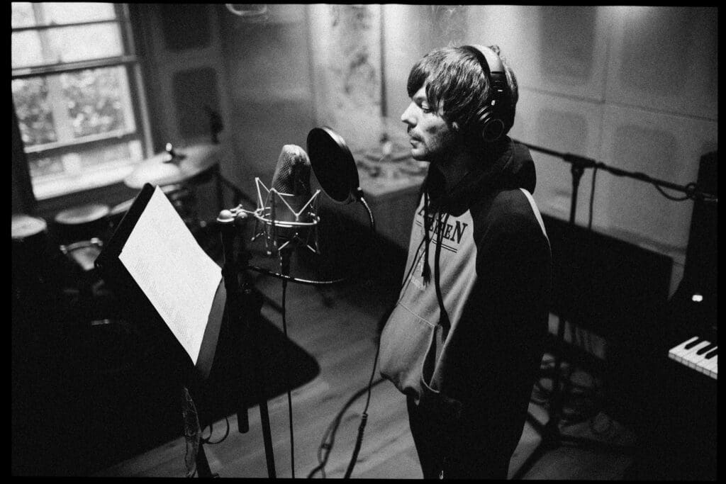 Louis Tomlinson in studio recording Faith In The Future