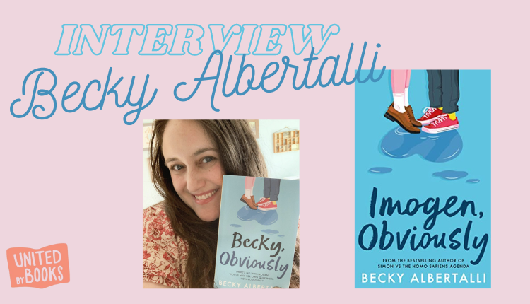 Becky Albertalli is holding a proof of Imogen Obviously, which is customised to say Becky Obviously.