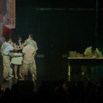 Singer-songwriter BIBI performing on stage with her dancers.