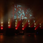 LED stage lights spelling out "WELCOME ANDEARS"