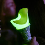 A GOT& lightstick with a bedazzled handle.